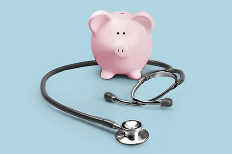 piggy bank with a stethoscope