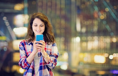 Young girl using her cell phone