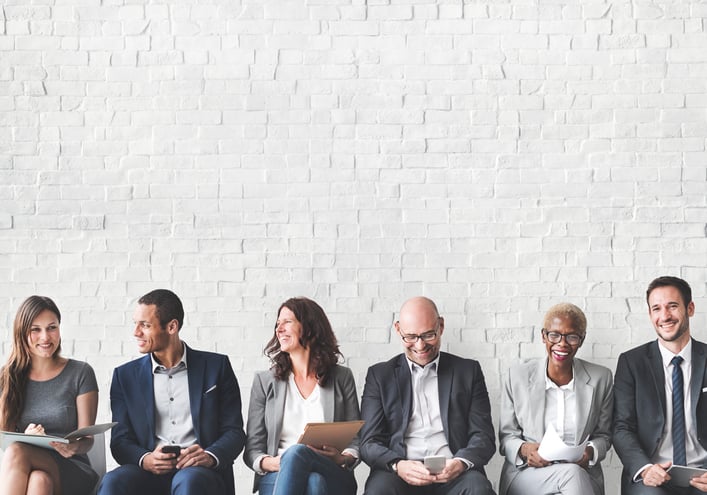 business people sitting in chairs