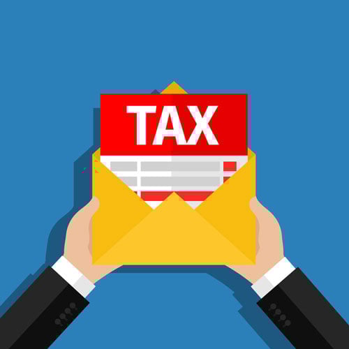 Hands holding open an envelope with a tax return in it Hands holding open an envelope with a tax return in it