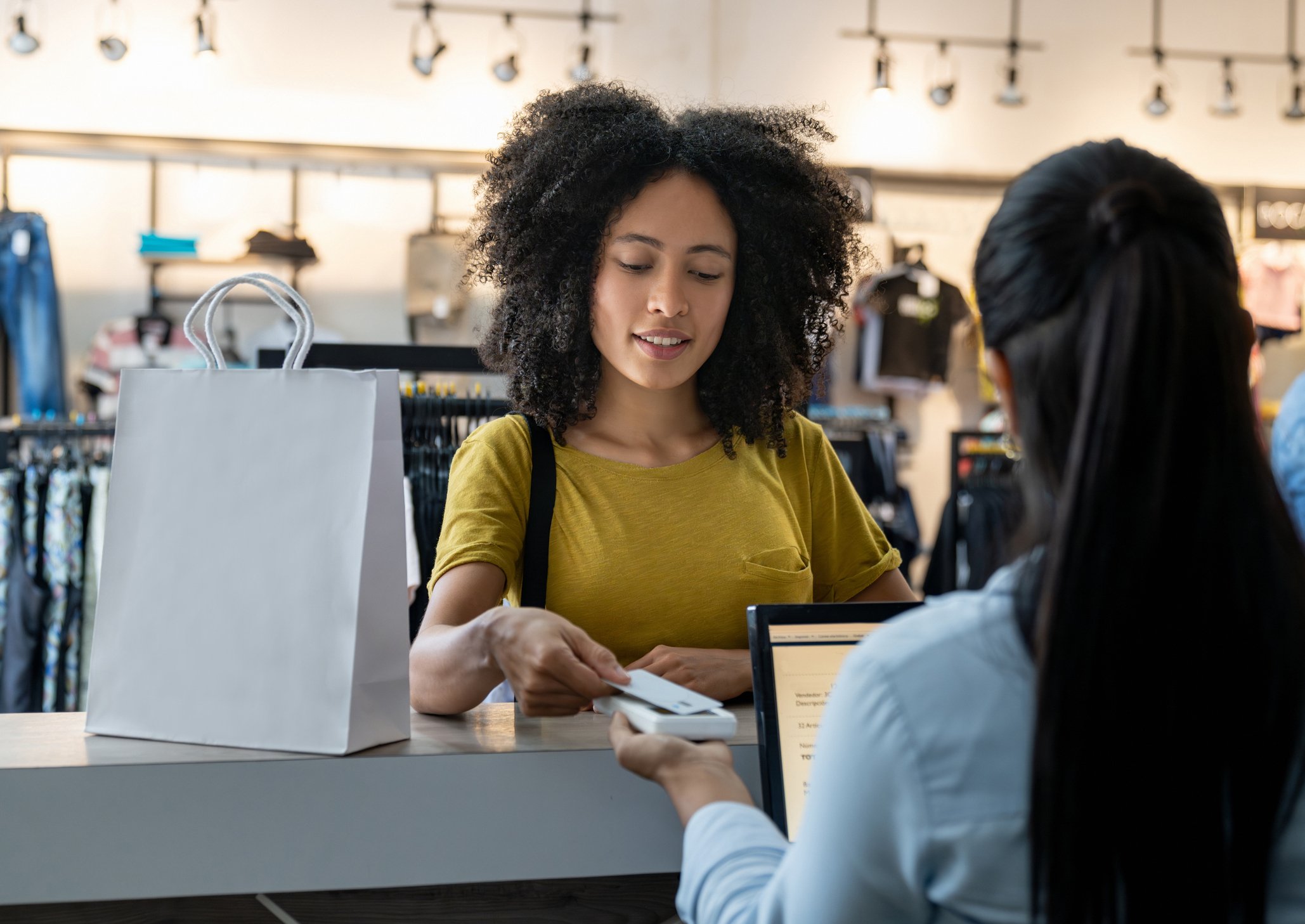 Women paying with her store credit card