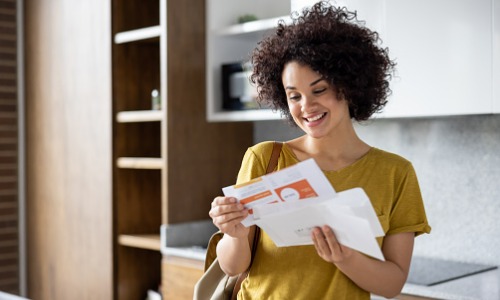 Woman checking her main in new home