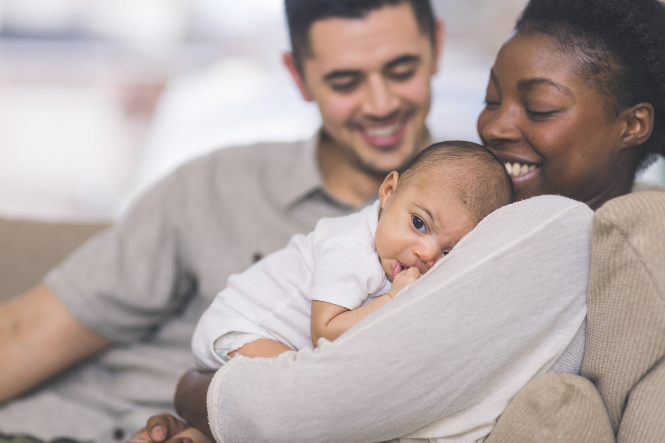 New mom holds newborn on chest