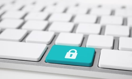 Close up of a keyboard with a padlock on a key