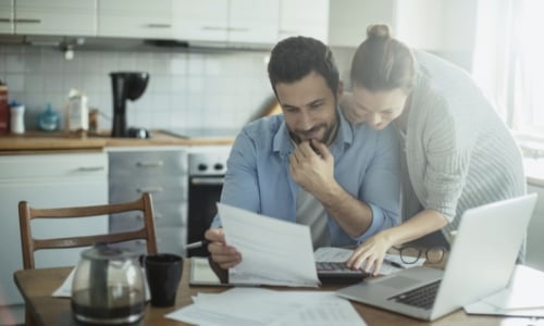 A couple working on their taxes together