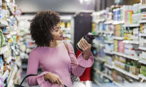 A woman grocery shopping