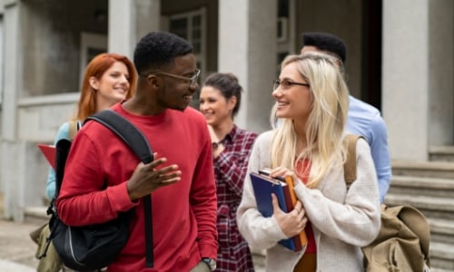 College kids on campus talking in a group