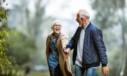 Retired couple walking in the park