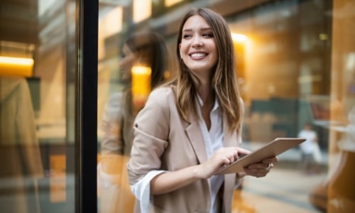 Woman using her digital device to look at her bank account