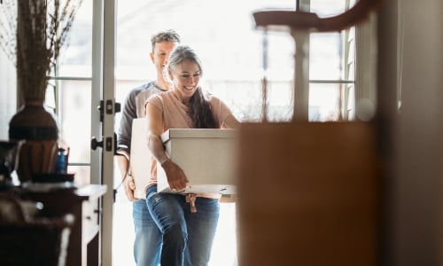 A couple moving into a house