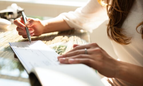 A woman looking over paperwork