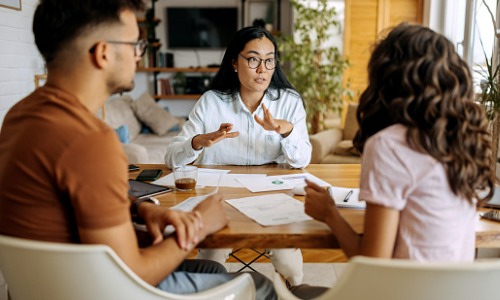 Young couple getting advice from mortgage expert