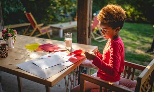 Child doing art project at home