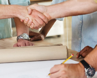shaking hands during a business meeting