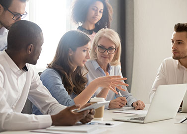 people collaborating around a desk