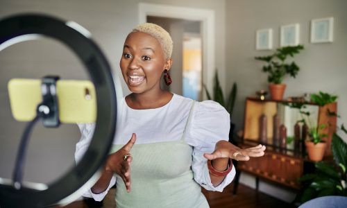 Smiling Young Female Influencer doing Content