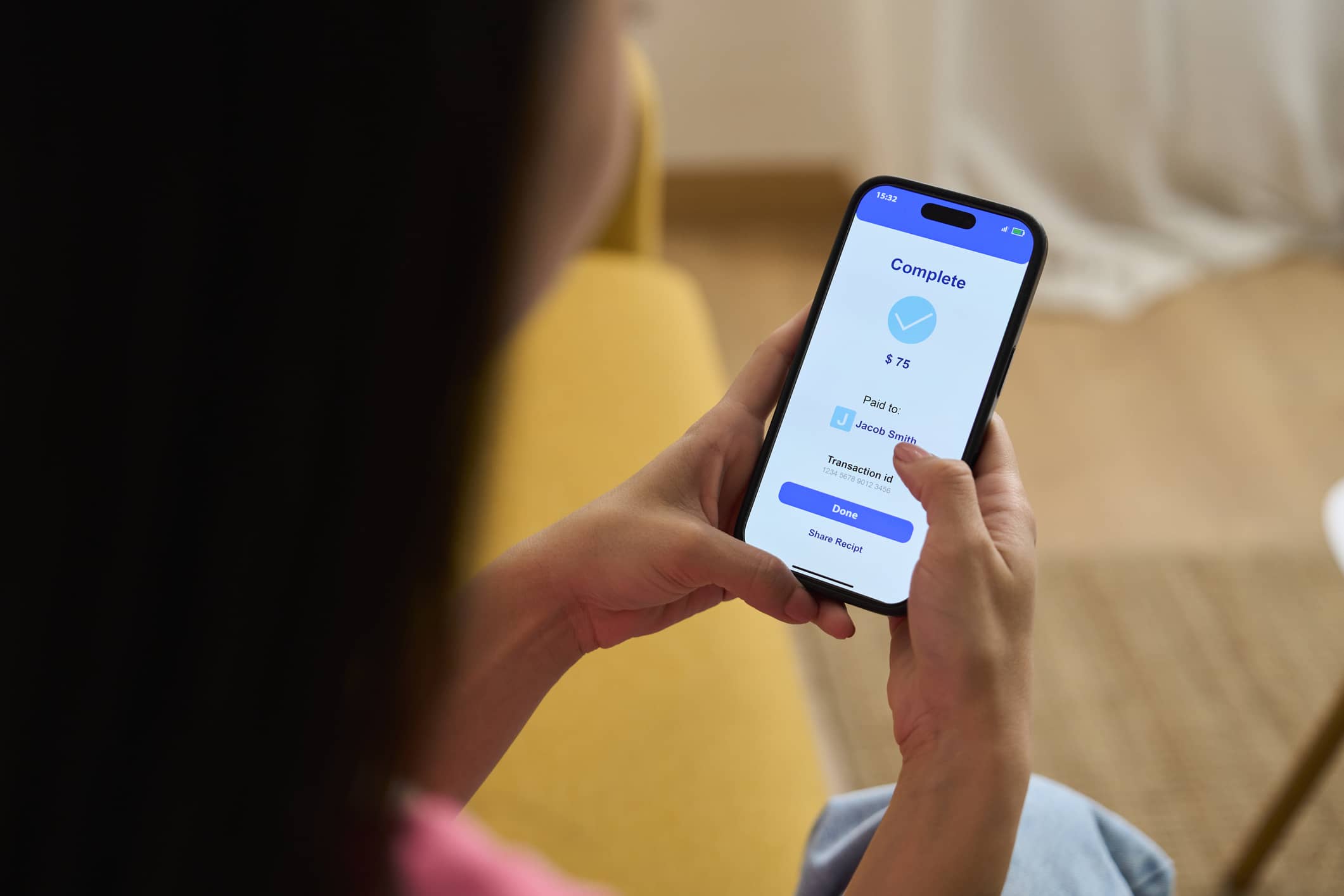 Woman completing mobile payments on smartphone.