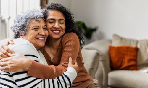 Mother and daughter hugging 