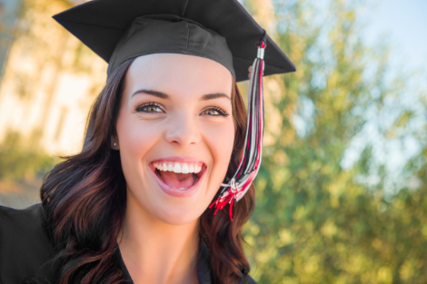 a dental graduate smiling at the camera