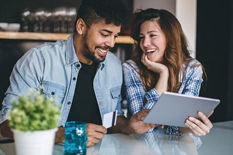 couple using online banking to make a mortgage payment