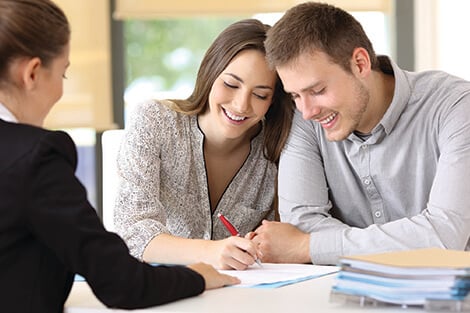 Achieve your next financial goal with a personal loan couple meeting with a personal banker