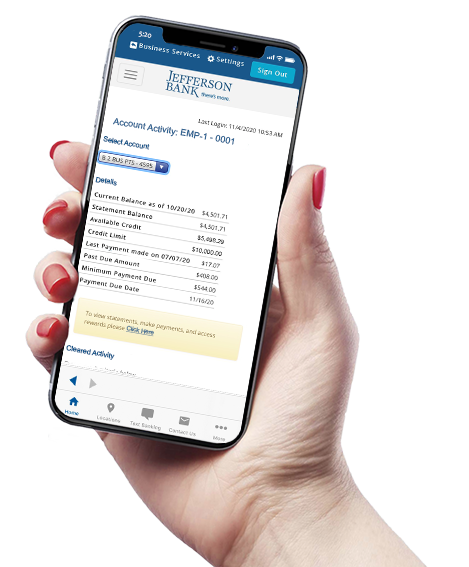 hand holding a mobile phone with the mobile app showing