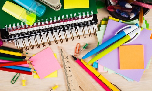 School supplies on a wooden desk