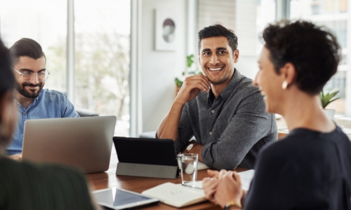 Group of employees in a conference room having a meeting