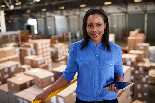 Woman standing in a warehouse