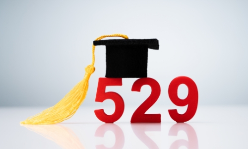 A cut-out of the numbers 529 with a graduation cap
