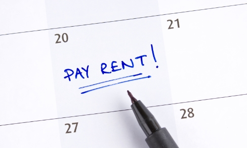 "Pay Rent" reminder written on a calendar