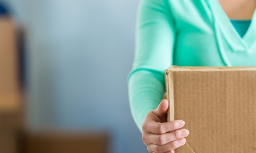 Woman holding a moving box