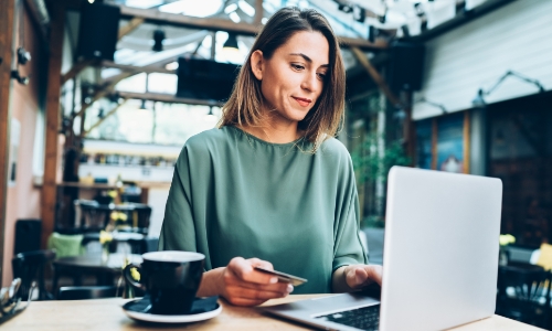 A woman shopping online with her credit card