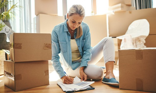 Woman using new homeowner checklist