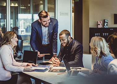 group of people talking in a conference room