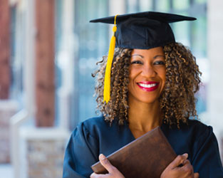 Graduate holding diploma